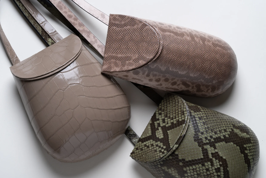 Andrea Marron handbag collection in neutral and green finishes